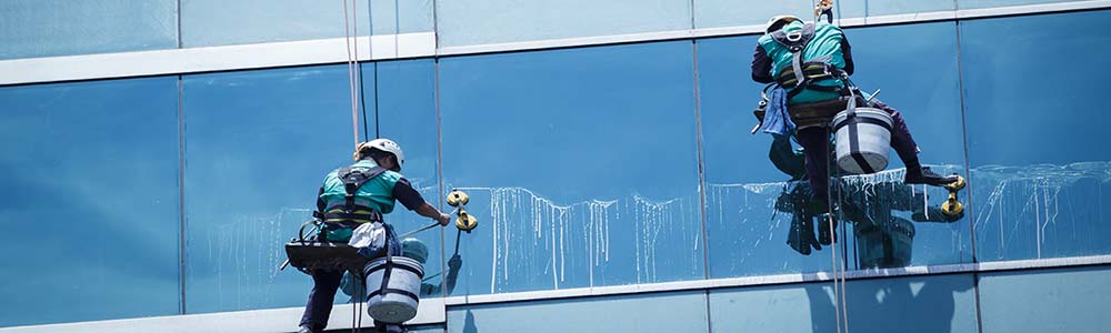 Commercial window cleaning on a high rise glass facade in Providence